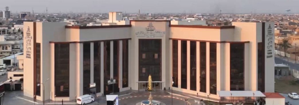 Royal Private Hospital in Fallujah — aerial view of the hospital facade and forecourt fountain.